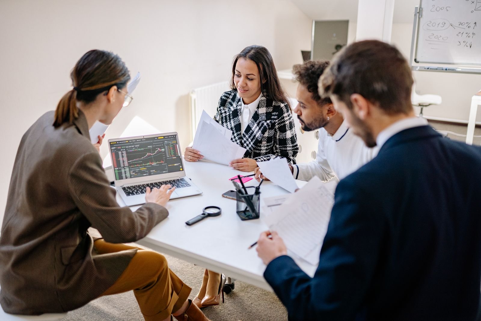 Revenue cycle team reviewing results on a laptop
